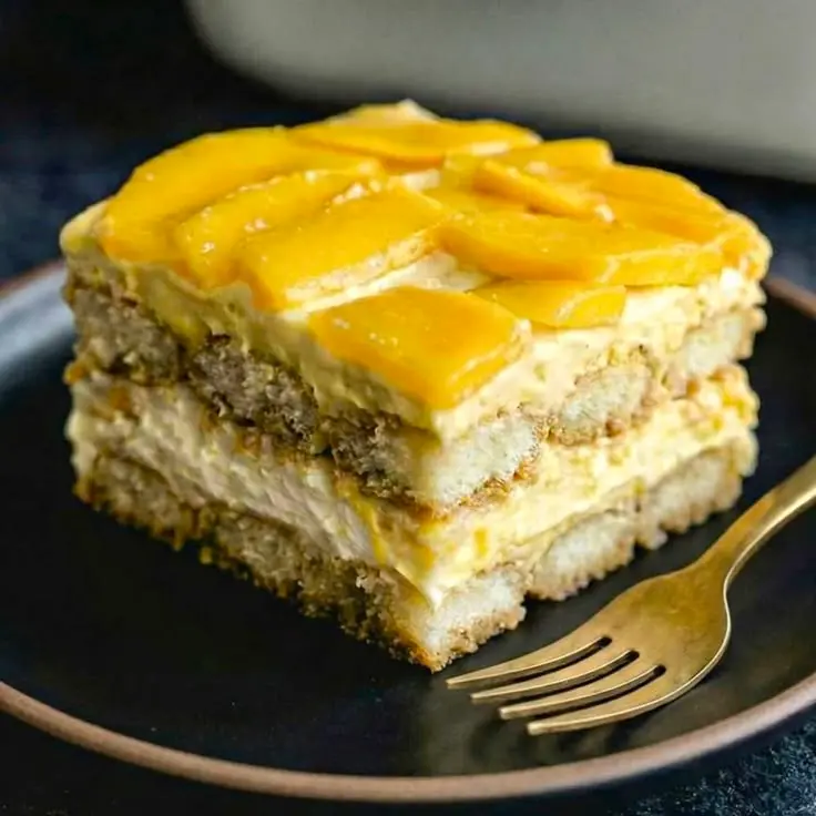 Eggless mango tiramisu layered in a glass, made with Dolcetti Eggless Savoiardi